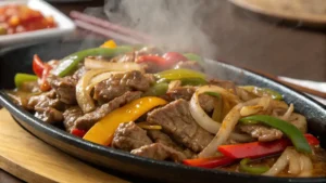 Close-up of Chinese Pepper Steak with Onions.