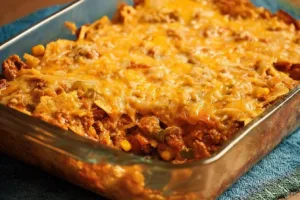 Delicious easy nacho casserole topped with cheese and jalapeños