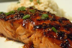 Spicy Hoisin-Glazed Salmon served on a plate with garnish.