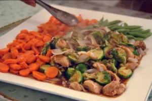 Colorful vegetable and chicken stir-fry served in a bowl.